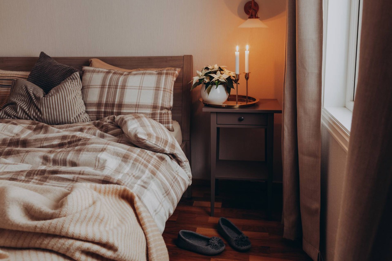 A cozy bedroom interior design style with neutral drapes for the fall and winter months at Blind King near Providence, RI