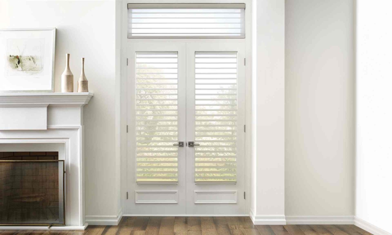 Sheer shades as contemporary living room window treatments on French doors next to a fireplace at Blind King near Providence, RI