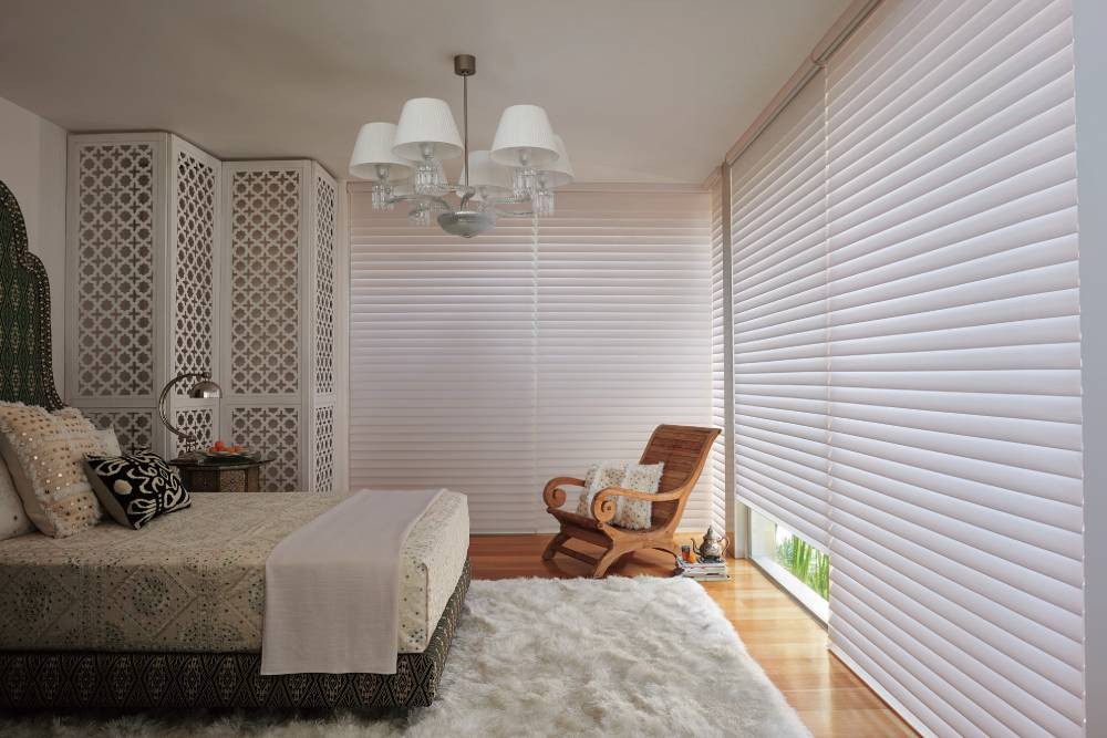 Hunter Douglas Silhouette® Sheer Shades filtering light in a home bedroom near Providence, RI